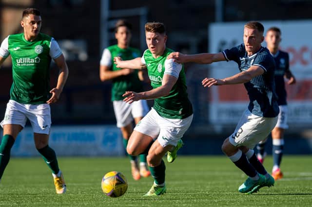 Hibs striker Kevin Nisbet looks to give Liam Dick of Raith Rovers the slip during Iain Davidson's testimonial at Stark's Park