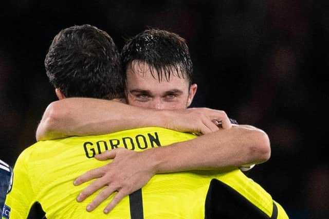 John Souttar hugs Hearts team-mate Craig Gordon after Scotland's win on Monday.
