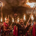 Vikings from the Shetland South Mainland Up Helly Aa Jarl Squad lead the torchlight procession through Edinburgh city centre, the opening event for the Hogmanay celebrations., on December 29.