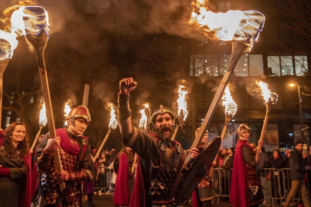 Vikings from the Shetland South Mainland Up Helly Aa Jarl Squad lead the torchlight procession through Edinburgh city centre, the opening event for the Hogmanay celebrations., on December 29.