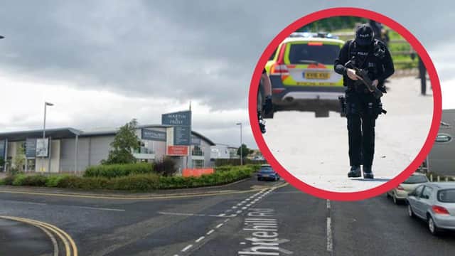 Armed officers attended the scene at Fort Kinnaird.