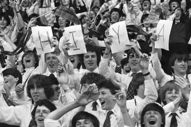 Youngsters hold up a HIYA sign for Pope John Paul II at Murrayfield. Around 40.000 young people from all over Scotland came for the Scottish National Youth Pilgrimage, singing 'You'll Never Walk Alone' and chanting 'John Paul, John Paul'.