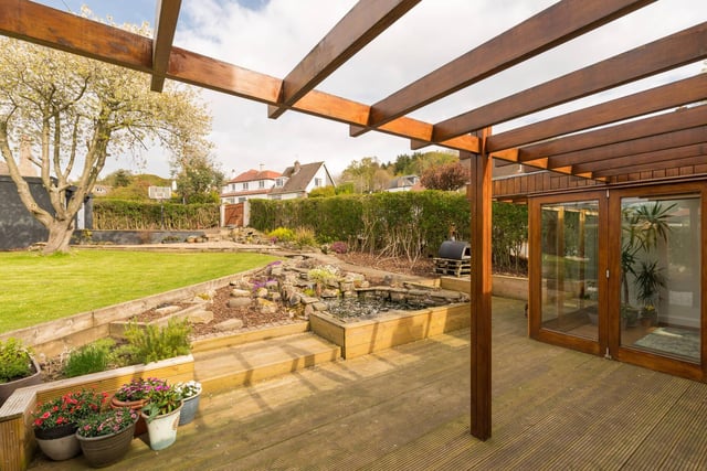 The well presented decking provides the perfect border between the garden and the home.