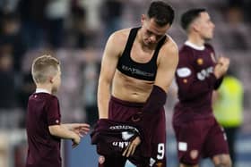 Lawrence Shankland hands his top to a young fan at full time. Picture: Mark Scates / SNS