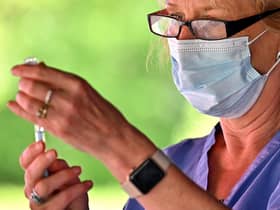 A health worker prepares to vaccinate members of the public on the South Side of Glasgow. Picture: Jeff J Mitchell/Getty Images