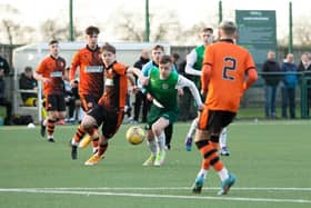 Josh McCulloch battles for possession during the under-18s clash at HTC. Picture: Maurice Dougan