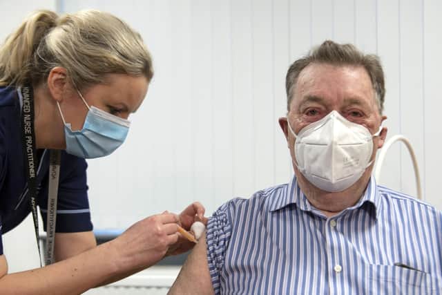 A dose of the AstraZeneca/Oxford Covid vaccine is given to 82-year-old James Shaw, the first person in Scotland to receive the vaccination, at the Lochee Health Centre in Dundee (Picture: Andy Buchanan/WPA Pool/Getty Images)