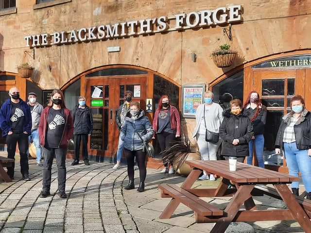 Regulars and staff at the Blacksmith's Forge pub in Dalkeith.
