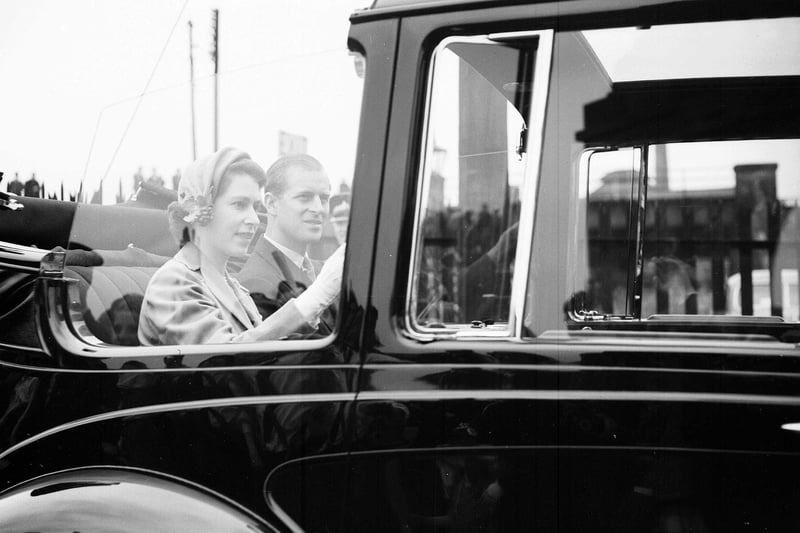 Queen Elizabeth II and the Duke of Edinburgh arrive by limousine at Murrayfield for the youth rally.