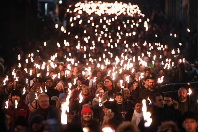 The torchlight procession is making a comeback this year, along with other Hogmanay festivities (Image credit: Getty Images)