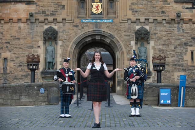 Guide Mhairi Summers, Pipe Major Stevie Small AND Drum Major Mick Hay open the iconic doors to Edinburgh Castle as the famous fortress welcomes visitors for the first time since closing in March.