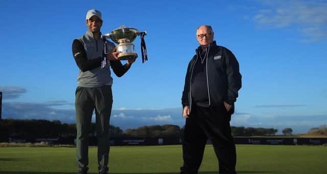 England's Aaron Rai, left, won the last staging of the Aberdeen Standard Investments Scottish Open under its current contract but Aberdeen Standard Life chairman Sir Douglas Flint, right, was hopeful a new deal could be struck for the Rolex Series event and that has indeed been the case. Picture: Andrew Redington/Getty Images
