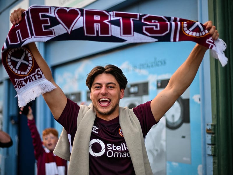 Hearts fans react outside the stadium after their team's victory (Photo by ANDY BUCHANAN / AFP via Getty Images)