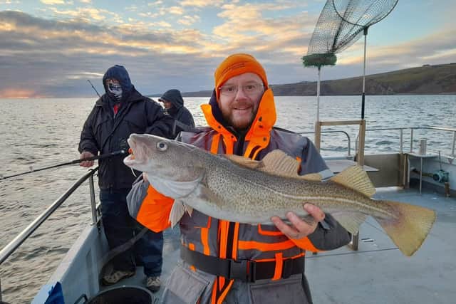 Paul Christie landed this big cod with Aquamarine Charters of Eyemouth who have confirmed seasonal sailings on December 26, 27, 28 and 31. Picture: Aquamarine Charters