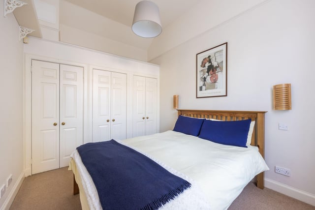 The double bedroom comes with fitted wardrobes, including storage space above.