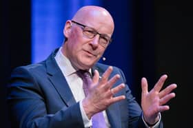 First Minister and Scottish National Party (SNP) leader John Swinney speaking to host Alan Cumming during event at the Assembly Rooms in Edinburgh ahead of the upcoming Holyrood election. Picture: Jane Barlow/PA Wire