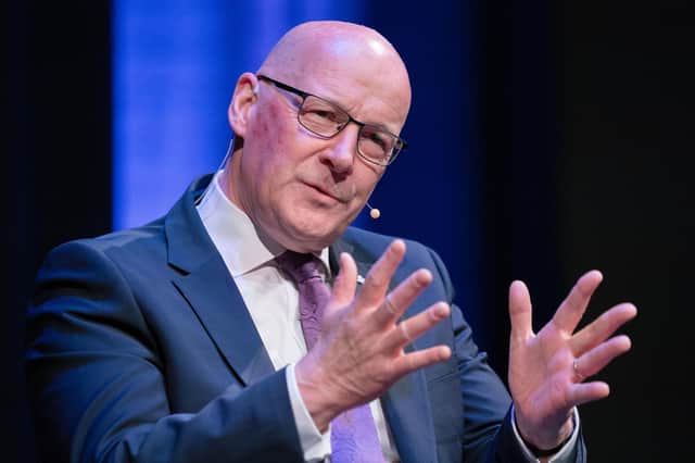 First Minister and Scottish National Party (SNP) leader John Swinney speaking to host Alan Cumming during event at the Assembly Rooms in Edinburgh ahead of the upcoming Holyrood election. Picture: Jane Barlow/PA Wire