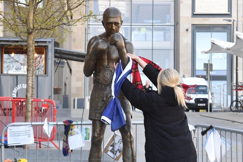 Touching tributes have been left for Ken Buchanan at his statue at the St James Quarter. Ken attended the grand unveiling of the statue last summer.