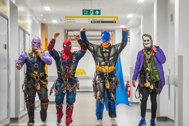 The superheros on their way to visit patients