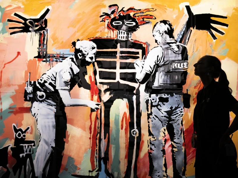 'Basquiat being stop and searched' (London 2017) on display at the new show by street Banksy 'Cut & Run' opens this Sunday at Glasgow's GoMA, revealing for the first time the stencils used to create many of the artist's most iconic works.