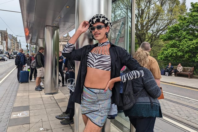 One Edinburgh fan dressed in a stylish monochromatic outfit for the concert, posing as they waited for the tram on Princes Street.