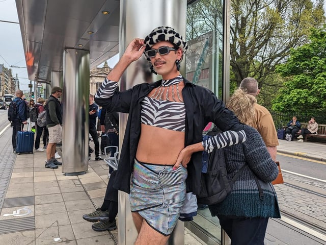 One Edinburgh fan dressed in a stylish monochromatic outfit for the concert, posing as they waited for the tram on Princes Street.