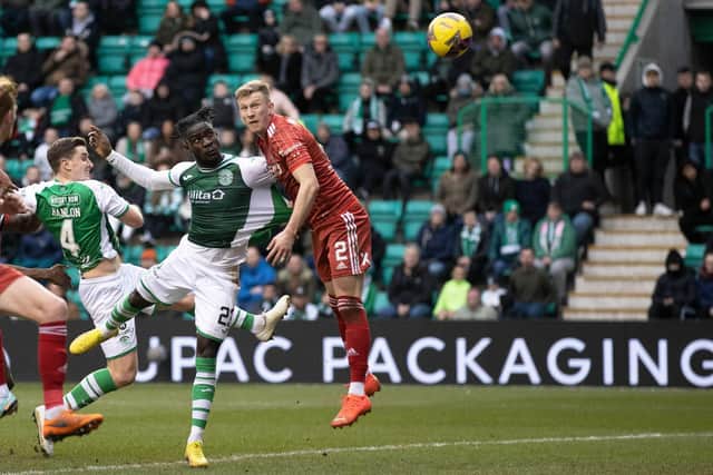 Elie Youan scores with a header in the 6-0 win over Aberdeen, a result which changed everything for the player. Picture: SNS