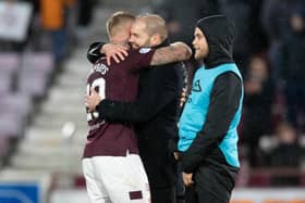 Hearts manager Robbie Neilson hugs Stephen Humphrys at full-time against Dundee United.