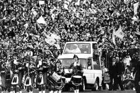 Crowds of young people welcome Pope John Paul II to Murrayfield Stadium during his 1982 visit to Scotland.