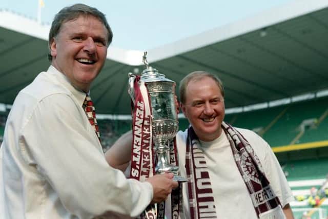 Hearts manager Jim Jefferies and assistant Billy Brown celebrate with the Scottish Cup. (Picture: SNS)