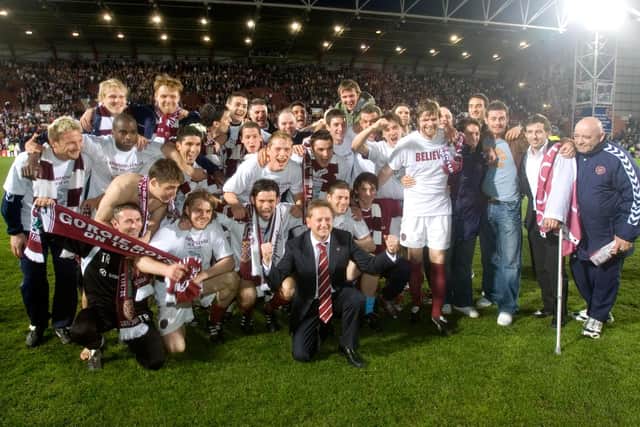 Hearts players and Vladimir Romanov celebrate after clinching second place in the Scottish top flight. Picture: SNS