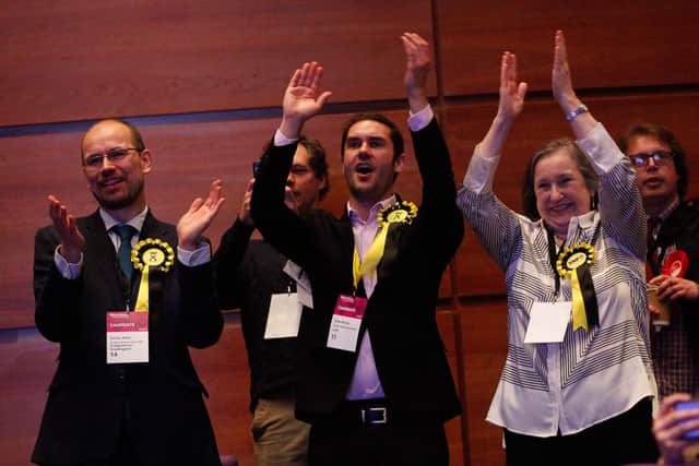 SNP group leader Adam McVey (centre) applauds one of his party's candidates being elected.   Photo: Scott Louden