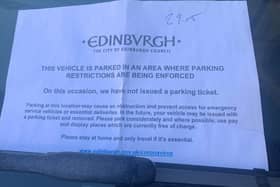 An example of the note being placed on vehicles parked illegally
