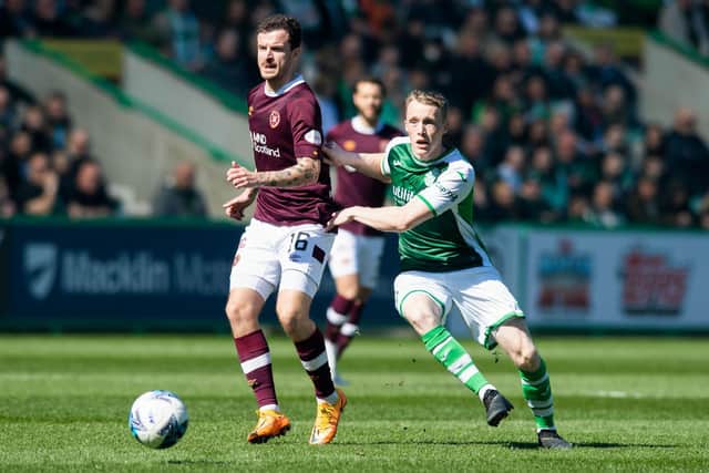 Doyle-Hayes marshalls Hearts counterpart Andy Halliday during the Edinburgh derby