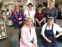 Back row: Dana Jupp (Library Assistant), Lynn Kinmont (catering team), Brooke McHale (catering team) and Becky Shanks (Library Assistant). Seated: Council Leader, Councillor Kelly Parry and Marie Dickinson (catering team).