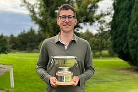 Dunbar's Jamie Duguid shows off the South East District Open trophy after his six-shot success at Bathgate. Picture: Lothians Golf Association