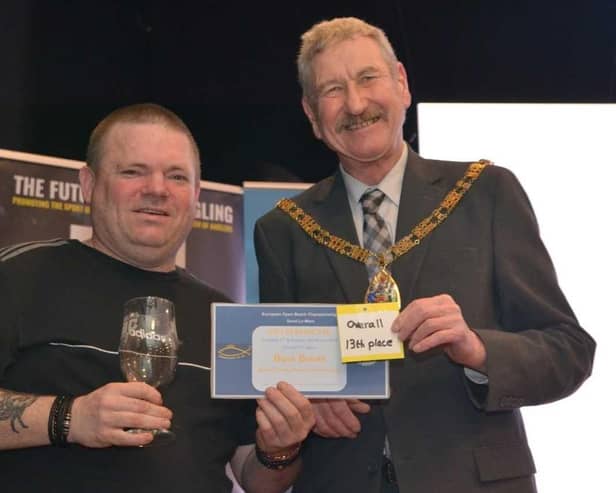 Craig Ogilvie (left) receiving his prize at the Paul Roggeman event in Yorkshire