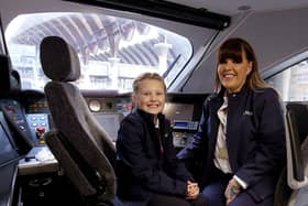 LNER driver Becky Brown and her daughter Maisie in a train cab. PIcture: Nigel Roddis/PA Wire