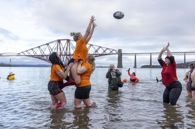 Rugby players enjoy a game in the waters
