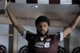 Ellis Simms posing with the Hearts scarf after completing his move. Picture: Hearts TV