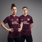 Hearts today launched their new home kit, modelled by Emma Brownlie from the women's team and Cammy Devlin from the men's. Pic: Heart of Midlothian FC