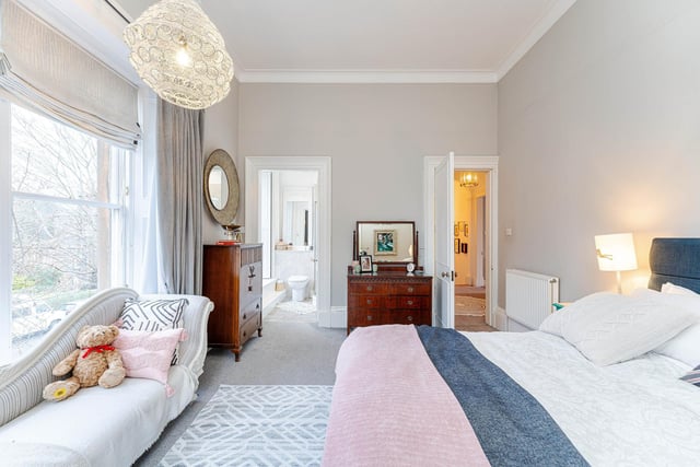 The Newington property's principal bedroom benefits from an en-suite shower room.