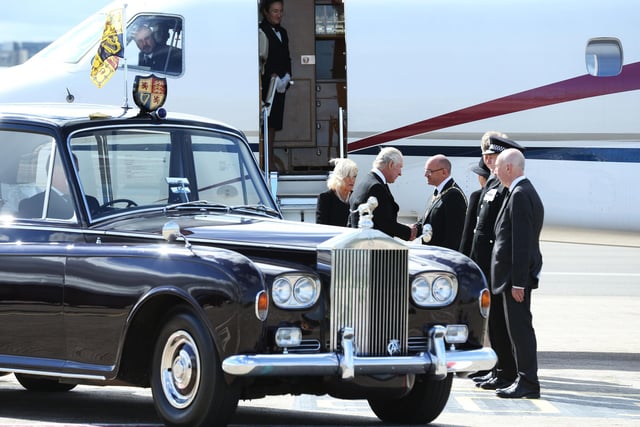 King Charles III and the Queen Consort arrive at Edinburgh Airport after travelling from London, ahead of joining the procession of Queen Elizabeth's coffin from the Palace of Holyroodhouse to St Giles' Cathedral, Edinburgh. Picture date: Monday September 12, 2022.