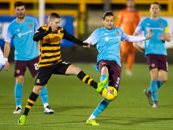 Alloa's Lee Connelly (left) tussles with Hearts' Peter Haring during the Betfred Cup match between Alloa Athletic and Heart of Midlothian at the Indodrill Stadium on November 28. (Photo by Mark Scates / SNS Group)