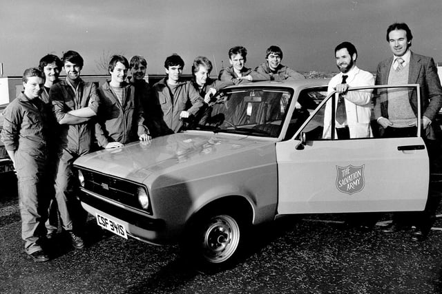 This 1978 Ford Escort was renovated and donated to the Salvation Army by students from Stevenson's College,  where they had been honing their practical skills on the car. Pictured, in December, 1983, are: lecturers Alan Skene (far right) and James Paden with lads from the departments involved in the restoration, including David Kaminski and Kevin Shaw.