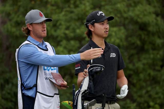Min Woo Lee and his caddie, Edinburgh man Stuart Davidson, talk tactics during the WGC--Dell Technologies Match Play at Austin Country Club in March. Picture: Harry How/Getty Images.