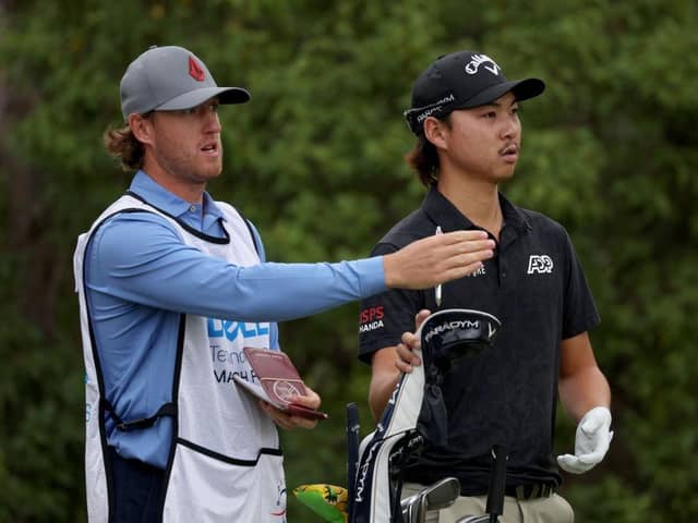 Min Woo Lee and his caddie, Edinburgh man Stuart Davidson, talk tactics during the WGC--Dell Technologies Match Play at Austin Country Club in March. Picture: Harry How/Getty Images.