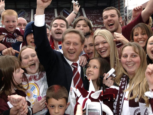 Hearts owner Vladimir Romanov celebrates with fans at Tynecastle Park after the side won the Scottish Cup by defeating Gretna on penalties in 2006.