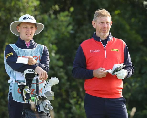 Stephen Gallacher talks tactics with son/caddie Jack during the Cazoo Classic at London Golf Club in August. Picture: Andrew Redington/Getty Images.