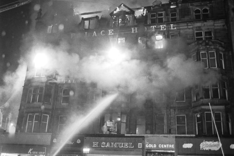Firemen direct their hoses onto the fron of the Palace Hotel on the corner of Castle in Edinburgh as fire takes hold in June 1991. The Palace was subsequently demolished and replaced by a new building.